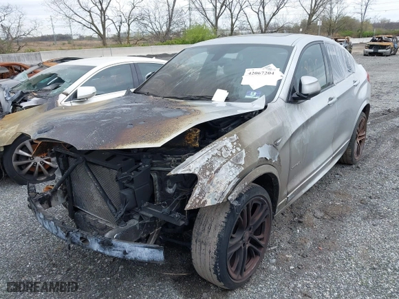 2016 BMW X4 xDrive28i with VIN 5UXXW3C55G0R20074, listed as a IAAI auction lot 42067204 with 91,169 mi miles. Bid and sale history available at carsss.com. Image 2.