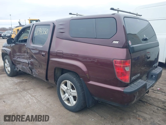 2011 Honda Ridgeline RTL with VIN 5FPYK1F51BB007959, listed as a IAAI auction lot 41894350 with 186,926 mi miles. Bid and sale history available at carsss.com. Image 3.