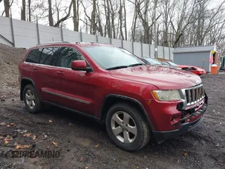 2012 Jeep Grand Cherokee Laredo with VIN 1C4RJFAG7CC123669, listed as a IAAI auction lot 42001472 with 164,806 mi miles. Bid and sale history available at carsss.com. Image 1.