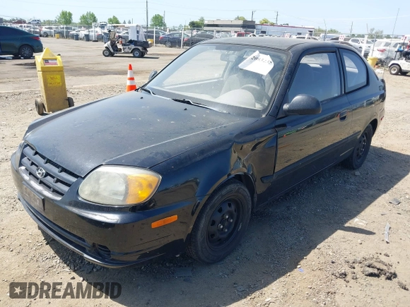 2003 Hyundai Accent with VIN KMHCF35CX3U271513, listed as a IAAI auction lot 42083235 with 166,240 mi miles. Bid and sale history available at carsss.com. Image 2.