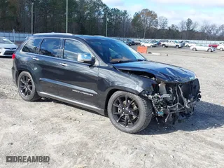 2015 Jeep Grand Cherokee Summit with VIN 1C4RJFJTXFC889977, listed as a IAAI auction lot 41078216 with 71,038 mi miles. Bid and sale history available at carsss.com. Image 1.