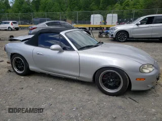 2004 Mazda MX-5 Miata LS with VIN JM1NB353640400140, listed as a Copart auction lot 56127165 with 123,276 mi miles and Salvage title. Bid and sale history available at DreamBid. Image 4.