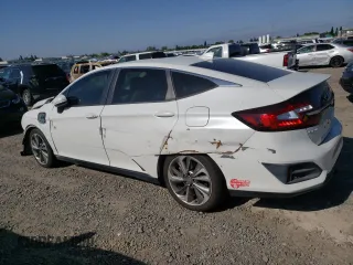 2018 Honda Clarity Touring z VIN JHMZC5F33JC002904, wystawiony jako Copart lot #55535325 z przebiegiem Nie podano mil oraz Szkoda całkowita • Salvage title. Historia ofert i sprzedaży dostępna na DreamBid. Obrazek 2.