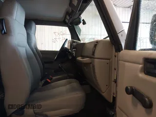 2003 Jeep Wrangler Sahara z VIN 1J4FA59S83P343234, wystawiony jako IAAI lot #41644074 z przebiegiem 197 461 mil mil oraz . Historia ofert i sprzedaży dostępna na DreamBid. Obrazek 5.