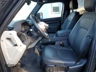 2023 Land Rover Defender S with VIN SALEJ7EX3P2121582, listed as a Copart auction lot 77433164 with 26,507 mi miles and Salvage title. Bid and sale history available at DreamBid. Image 7.
