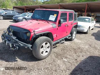 2007 Jeep Wrangler Unlimited X with VIN 1J4GB39197L150245, listed as a IAAI auction lot 41920390 with 239,532 mi miles and . Bid and sale history available at DreamBid. Image 2.