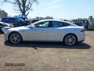 2015 Tesla Model S 85D with VIN 5YJSA1H2XFF084145, listed as a IAAI auction lot 42101755 with 105,660 mi miles. Bid and sale history available at carsss.com. Image 14.