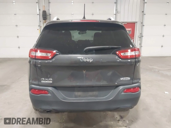 2014 Jeep Cherokee Altitude with VIN 1C4PJMCB2EW317346, listed as a IAAI auction lot 41861651 with 100,602 mi miles. Bid and sale history available at carsss.com. Image 16.