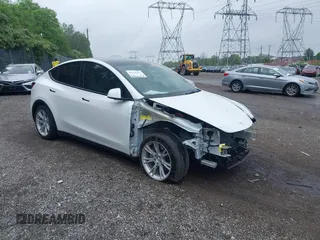 2021 Tesla Model Y Long Range z VIN 5YJYGDEE2MF098692, wystawiony jako IAAI lot #42162411 z przebiegiem 31 937 mil mil oraz . Historia ofert i sprzedaży dostępna na DreamBid. Obrazek 1.