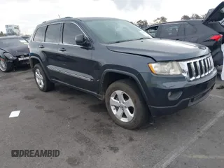 2013 Jeep Grand Cherokee Laredo with VIN 1C4RJEAGXDC620968, listed as a IAAI auction lot 41425270 with 127,739 mi miles. Bid and sale history available at carsss.com. Image 1.