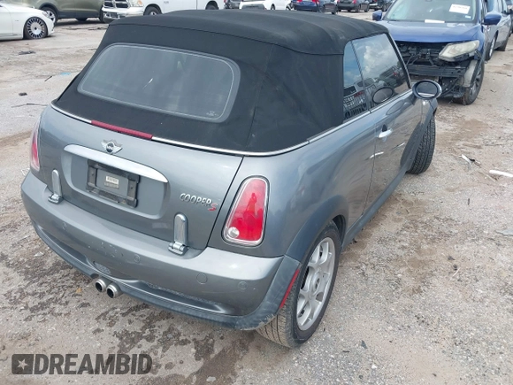 2006 MINI Convertible S with VIN WMWRH33586TF87791, listed as a IAAI auction lot 42679478 with 90,209 mi miles and . Bid and sale history available at DreamBid. Image 4.