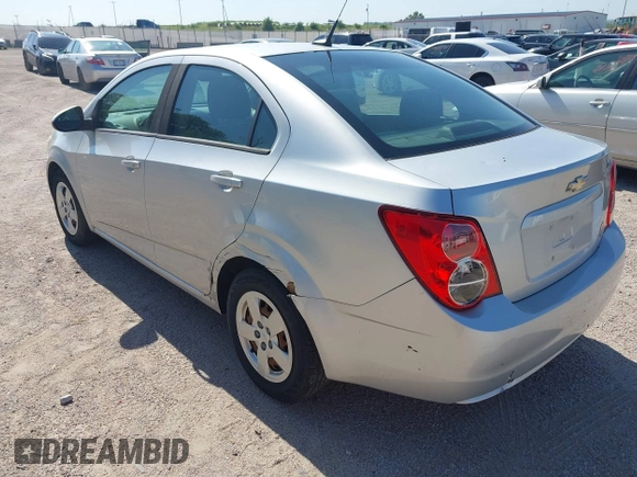 2013 Chevrolet Sonic LS with VIN 1G1JA5SH1D4246936, listed as a IAAI auction lot 42665664 with 124,464 mi miles and . Bid and sale history available at DreamBid. Image 3.