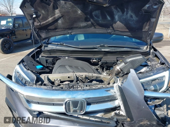 2021 Honda Pilot EX-L with VIN 5FNYF6H54MB028203, listed as a IAAI auction lot 41641116 with 46,755 mi miles and . Bid and sale history available at DreamBid. Image 10.