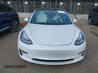 2020 Tesla Model 3 Standard Range Plus with VIN 5YJ3E1EA5LF613002, listed as a IAAI auction lot 42129085 with 55,672 mi miles. Bid and sale history available at carsss.com. Image 13.