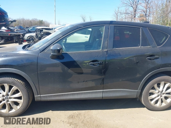 2014 Mazda CX-5 Grand Touring with VIN JM3KE4DY1E0339690, listed as a IAAI auction lot 41668780 with 216,825 mi miles. Bid and sale history available at carsss.com. Image 14.