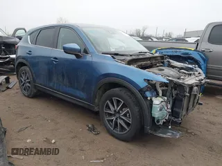 2017 Mazda CX-5 Grand Touring with VIN JM3KFADL9H0187338, listed as a IAAI auction lot 41382034 with 141,972 mi miles and . Bid and sale history available at carsss.com. Image 1.