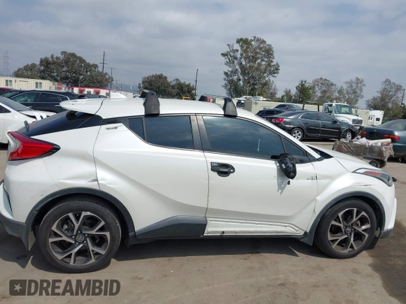 2019 Toyota C-HR XLE with VIN JTNKHMBX9K1054053, listed as a IAAI auction lot 42120256 with 67,083 mi miles and . Bid and sale history available at DreamBid. Image 13.