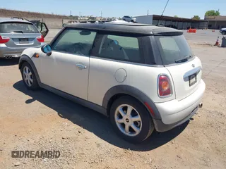 2010 MINI Hardtop with VIN WMWMF3C51ATZ23464, listed as a IAAI auction lot 42710259 with 124,660 mi miles and . Bid and sale history available at DreamBid. Image 3.