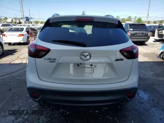 2016 Mazda CX-5 Grand Touring with VIN JM3KE4DY4G0669259, listed as a Copart auction lot 50470145 with 0 mi miles and Non Repairable. Bid and sale history available at carsss.com. Image 6.