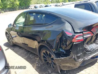 2022 Tesla Model Y Long Range z VIN 7SAYGDEE4NA006645, wystawiony jako IAAI lot #42192495 z przebiegiem 28 784 mil mil oraz . Historia ofert i sprzedaży dostępna na DreamBid. Obrazek 14.