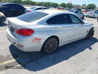 2015 BMW 4 Series 428i with VIN WBA4A5C58FGK15335, listed as a IAAI auction lot 41723243 with 152,652 mi miles and . Bid and sale history available at DreamBid. Image 4.