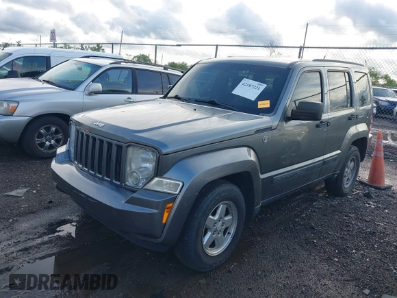 2012 Jeep Liberty Sport with VIN 1C4PJMAK1CW198611, listed as a IAAI auction lot 42187221 with 118,623 mi miles. Bid and sale history available at carsss.com. Image 2.