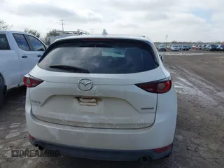 2020 Mazda CX-5 Touring with VIN JM3KFACM9L0771919, listed as a IAAI auction lot 41527773 with 93,417 mi miles and . Bid and sale history available at DreamBid. Image 17.