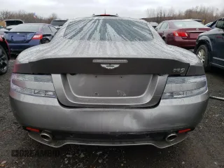 2015 Aston Martin DB9 z VIN SCFFDAEM9FGA16279, wystawiony jako Copart lot #81886554 z przebiegiem 25 029 mil mil oraz Szkody całkowita. Historia ofert i sprzedaży dostępna na DreamBid. Obrazek 6.