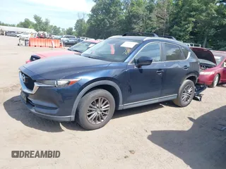 2017 Mazda CX-5 Touring z VIN JM3KFBCL5H0133493, wystawiony jako IAAI lot #39666644 z przebiegiem 125 048 mil mil oraz . Historia ofert i sprzedaży dostępna na DreamBid. Obrazek 18.