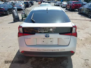 2021 Toyota Prius L Eco with VIN JTDKAMFU8M3133925, listed as a IAAI auction lot 41966660 with 115,193 mi miles. Bid and sale history available at carsss.com. Image 16.