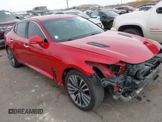 2019 Kia Stinger with VIN KNAE15LA1K6056093, listed as a IAAI auction lot 41620911 with 99,295 mi miles and . Bid and sale history available at DreamBid. Image 1.