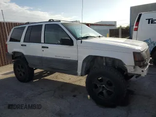 1998 Jeep Grand Cherokee Laredo with VIN 1J4GZ58S6WC319444, listed as a Copart auction lot 53147665 with 217,068 mi miles and Salvage Title. Bid and sale history available at carsss.com. Image 4.