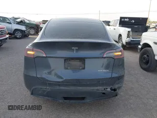 2023 Tesla Model Y Long Range with VIN 7SAYGDEE1PA053683, listed as a IAAI auction lot 42124517 with 32,295 mi miles. Bid and sale history available at carsss.com. Image 15.