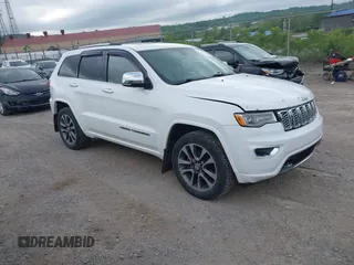 2017 Jeep Grand Cherokee Overland z VIN 1C4RJFCG5HC800402, wystawiony jako IAAI lot #42286116 z przebiegiem 136 348 mil mil oraz . Historia ofert i sprzedaży dostępna na DreamBid. Obrazek 1.