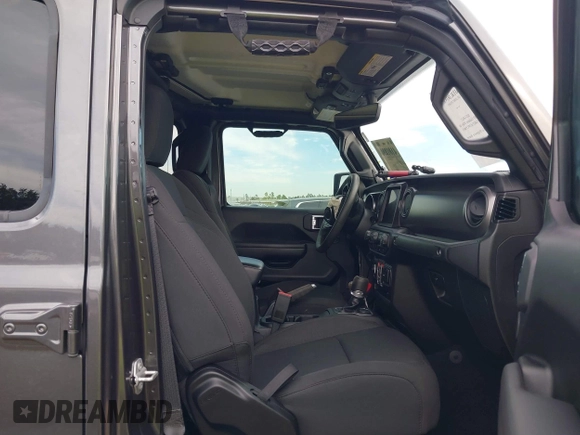 2023 Jeep Gladiator Sport S z VIN 1C6HJTAG9PL554845, wystawiony jako IAAI lot #41312360 z przebiegiem 18 077 mil mil oraz . Historia ofert i sprzedaży dostępna na DreamBid. Obrazek 5.