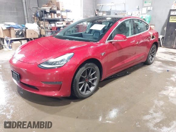 2020 Tesla Model 3 Standard Range Plus z VIN 5YJ3E1EA2LF705670, wystawiony jako IAAI lot #41572352 z przebiegiem 99 980 mil mil oraz . Historia ofert i sprzedaży dostępna na DreamBid. Obrazek 19.