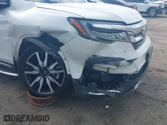 2020 Honda Pilot Elite with VIN 5FNYF6H08LB014288, listed as a IAAI auction lot 40496871 with 57,921 mi miles and . Bid and sale history available at DreamBid. Image 17.