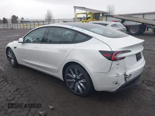 2025 Tesla Model 3 Long Range with VIN 5YJ3E1EB9SF890212, listed as a IAAI auction lot 41671411 with 3 mi miles and . Bid and sale history available at DreamBid. Image 3.