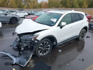 2016 Mazda CX-5 Grand Touring with VIN JM3KE4DY0G0705691, listed as a IAAI auction lot 40880798 with 130,624 mi miles. Bid and sale history available at carsss.com. Image 17.