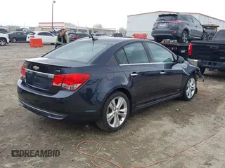 2014 Chevrolet Cruze LTZ z VIN 1G1PG5SB7E7335060, wystawiony jako IAAI lot #41710133 z przebiegiem 170 000 mil mil oraz . Historia ofert i sprzedaży dostępna na DreamBid. Obrazek 4.