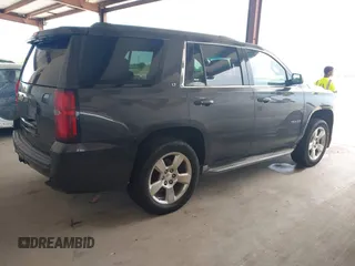 2015 Chevrolet Tahoe LT with VIN 1GNSCBKC5FR105437, listed as a IAAI auction lot 42052084 with 348,093 mi miles and . Bid and sale history available at DreamBid. Image 4.