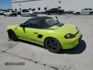 1999 Porsche Boxster with VIN WP0CA2987XU622760, listed as a Copart auction lot 59898355 with 104,425 mi miles and Salvage title. Bid and sale history available at DreamBid. Image 2.