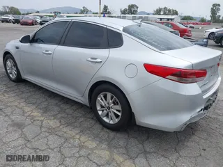 2016 Kia Optima LX with VIN KNAGT4L3XG5111796, listed as a IAAI auction lot 42106116 with 138,184 mi miles. Bid and sale history available at carsss.com. Image 3.