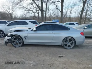 2015 BMW 4 Series 428i xDrive with VIN WBA3N9C53FK247985, listed as a IAAI auction lot 41395534 with 76,856 mi miles and . Bid and sale history available at DreamBid. Image 14.