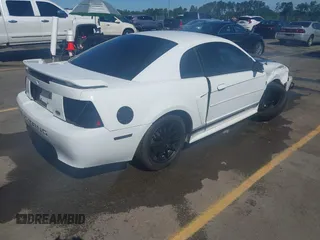 2004 Ford Mustang Standard z VIN 1FAFP40654F229283, wystawiony jako IAAI lot #42309648 z przebiegiem 164 610 mil mil oraz . Historia ofert i sprzedaży dostępna na DreamBid. Obrazek 4.