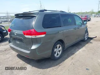 2011 Toyota Sienna LE AAS with VIN 5TDKK3DC7BS014356, listed as a IAAI auction lot 42137928 with 198,400 mi miles and . Bid and sale history available at DreamBid. Image 4.