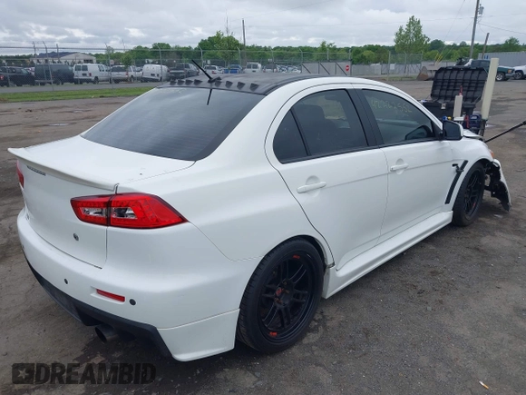 2013 Mitsubishi Lancer Evolution GSR z VIN JA32W8FV0DU023509, wystawiony jako IAAI lot #42222552 z przebiegiem 128 030 mil mil oraz . Historia ofert i sprzedaży dostępna na DreamBid. Obrazek 4.