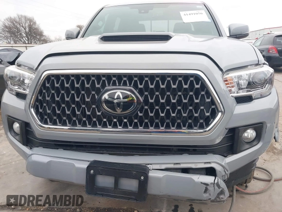 2018 Toyota Tacoma SR5 with VIN 5TFAZ5CNXJX065431, listed as a IAAI auction lot 41491056 with 39,024 mi miles and . Bid and sale history available at DreamBid. Image 6.