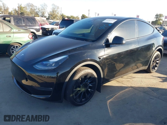 2024 Tesla Model Y Long Range with VIN 7SAYGDEEXRA216186, listed as a IAAI auction lot 41106653 with 25,331 mi miles and . Bid and sale history available at DreamBid. Image 19.