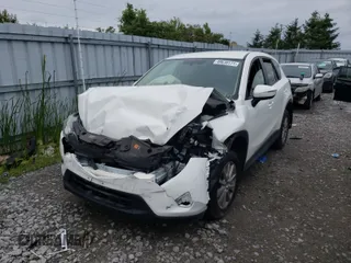 2016 Mazda CX-5 Sport with VIN JM3KE4BY2G0813636, listed as a Copart auction lot 51451863 with 120,336 mi miles and Non repairable. Bid and sale history available at DreamBid. Image 2.